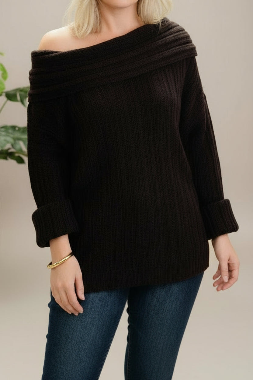 Person wearing a dark brown off-shoulder sweater with a belt, taking a mirror selfie.