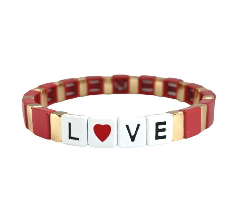 Accessory bracelet with red and gold enamel tiles and love heart slogan