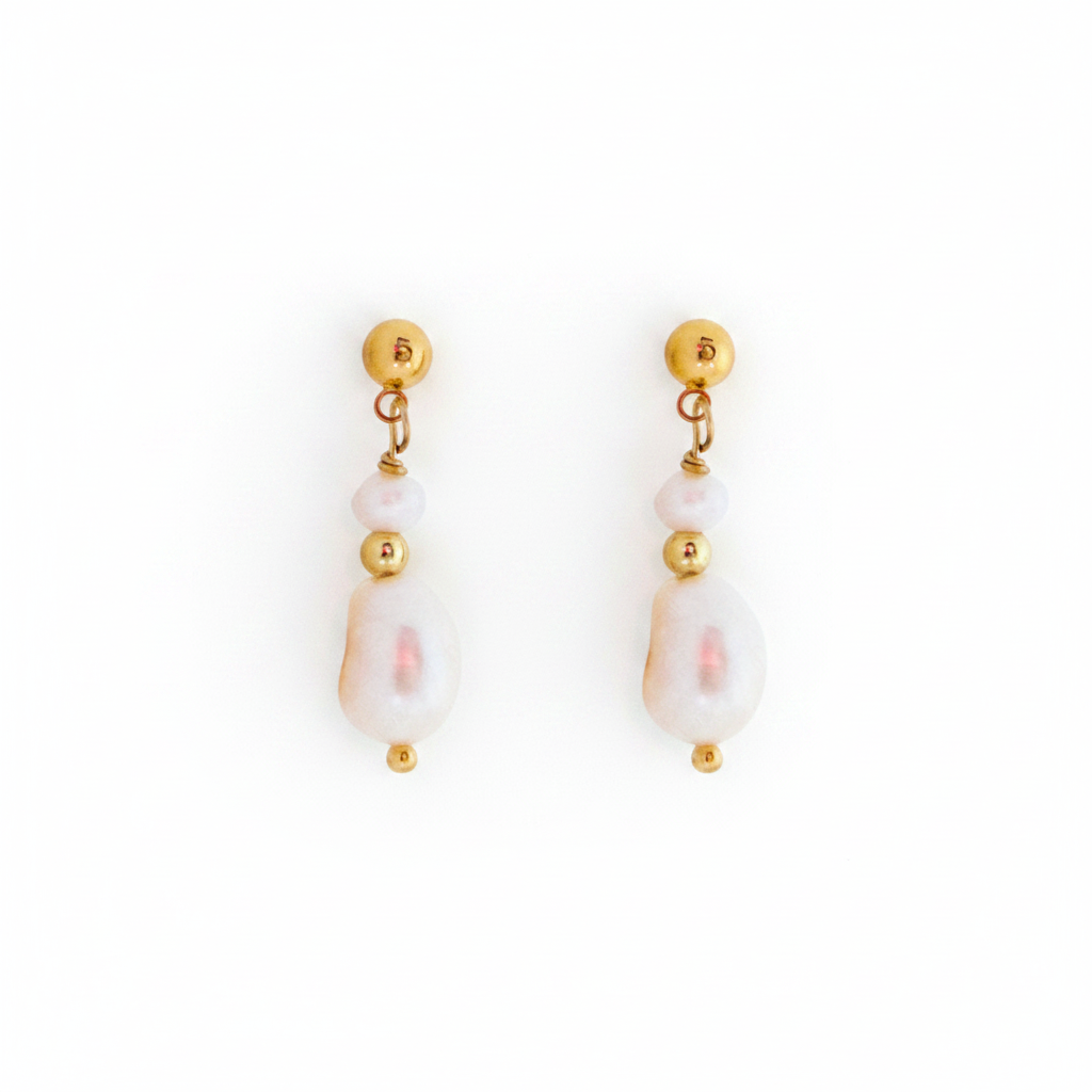 Pair of pearl earrings with gold accents on a white background