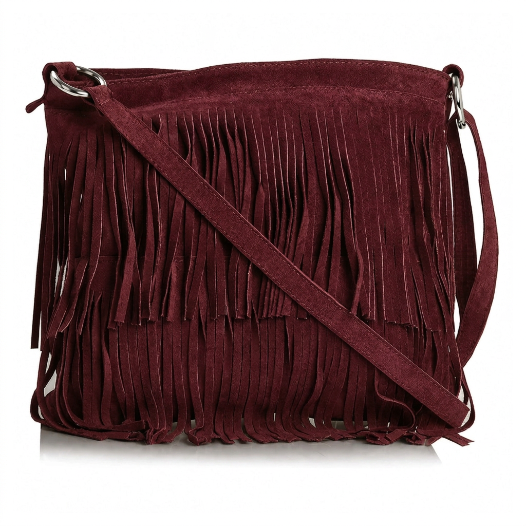 Brown suede handbag with fringe details on a white background