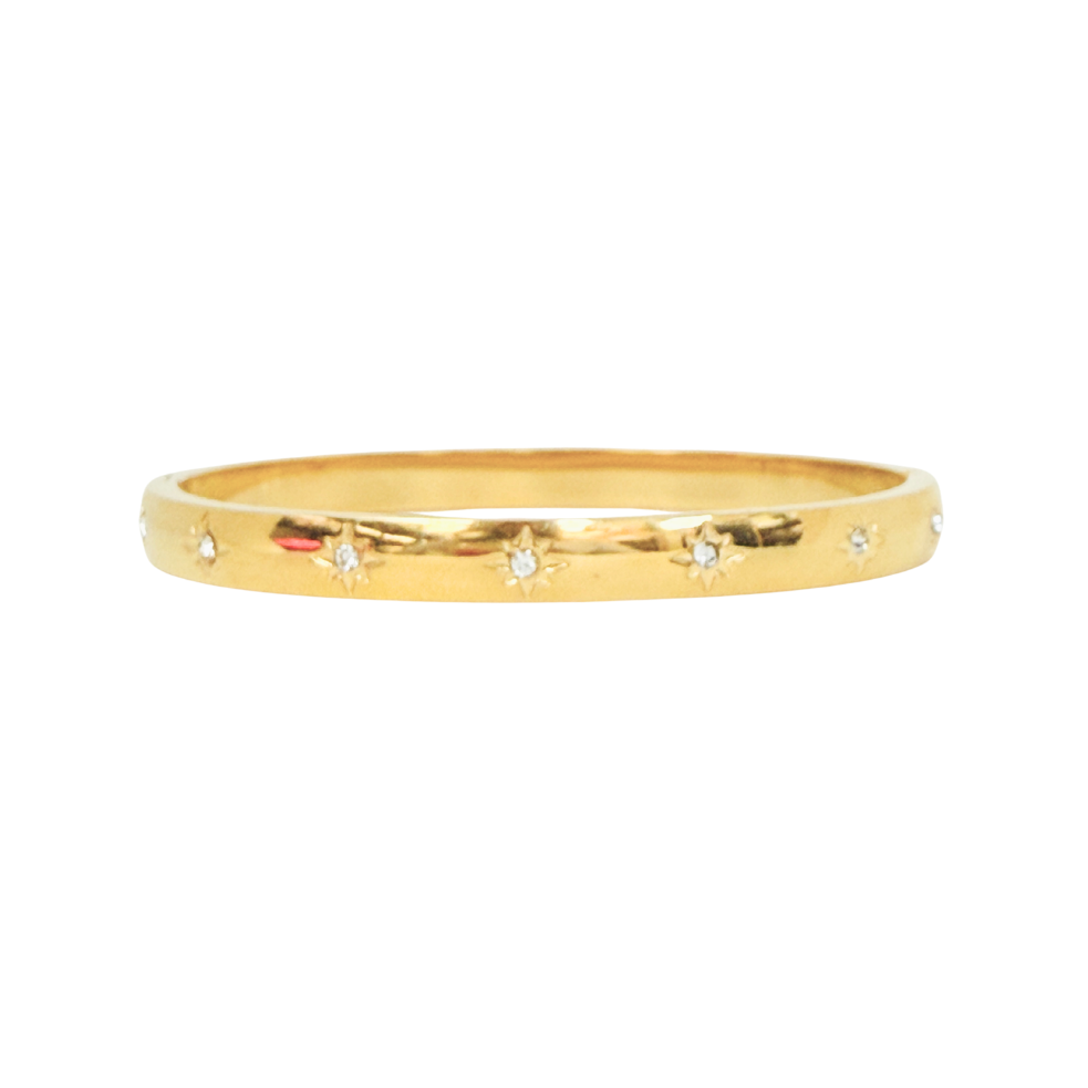 Gold bracelet with small diamonds on a white background