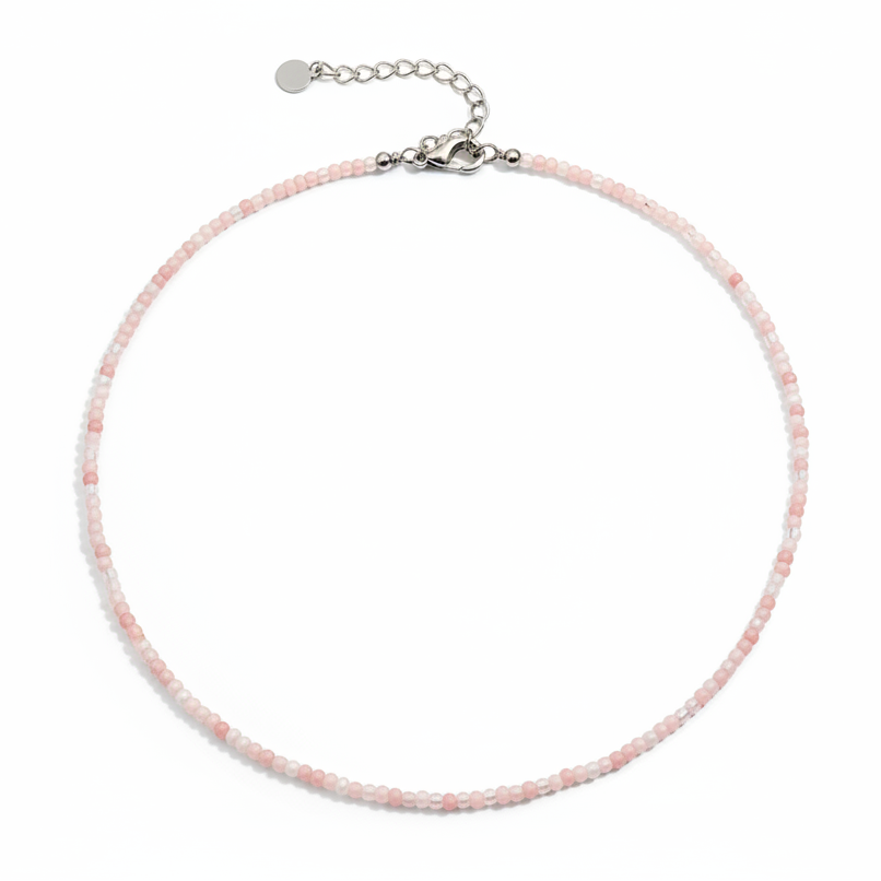 Necklace with pink beads on a white background