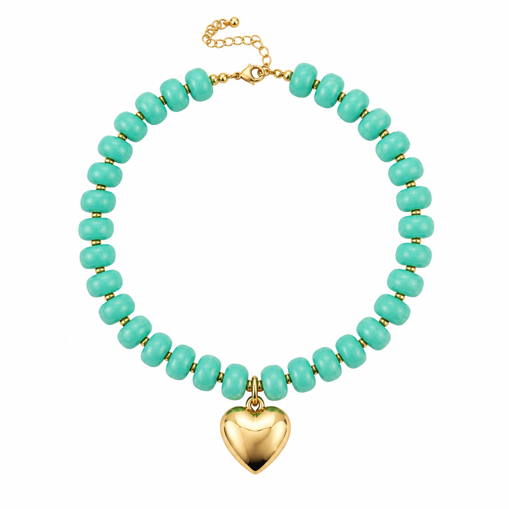 A beaded necklace featuring faceted turquoise-green beads and a polished gold heart-shaped pendant, displayed on a clean white background.