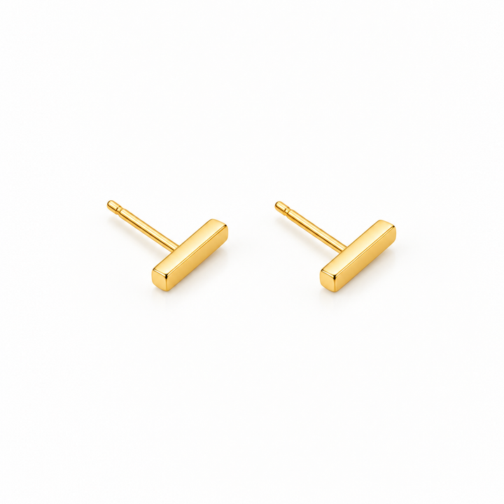 A pair of small gold stud earrings with a simple geometric T-shaped design, shown on a plain white background.