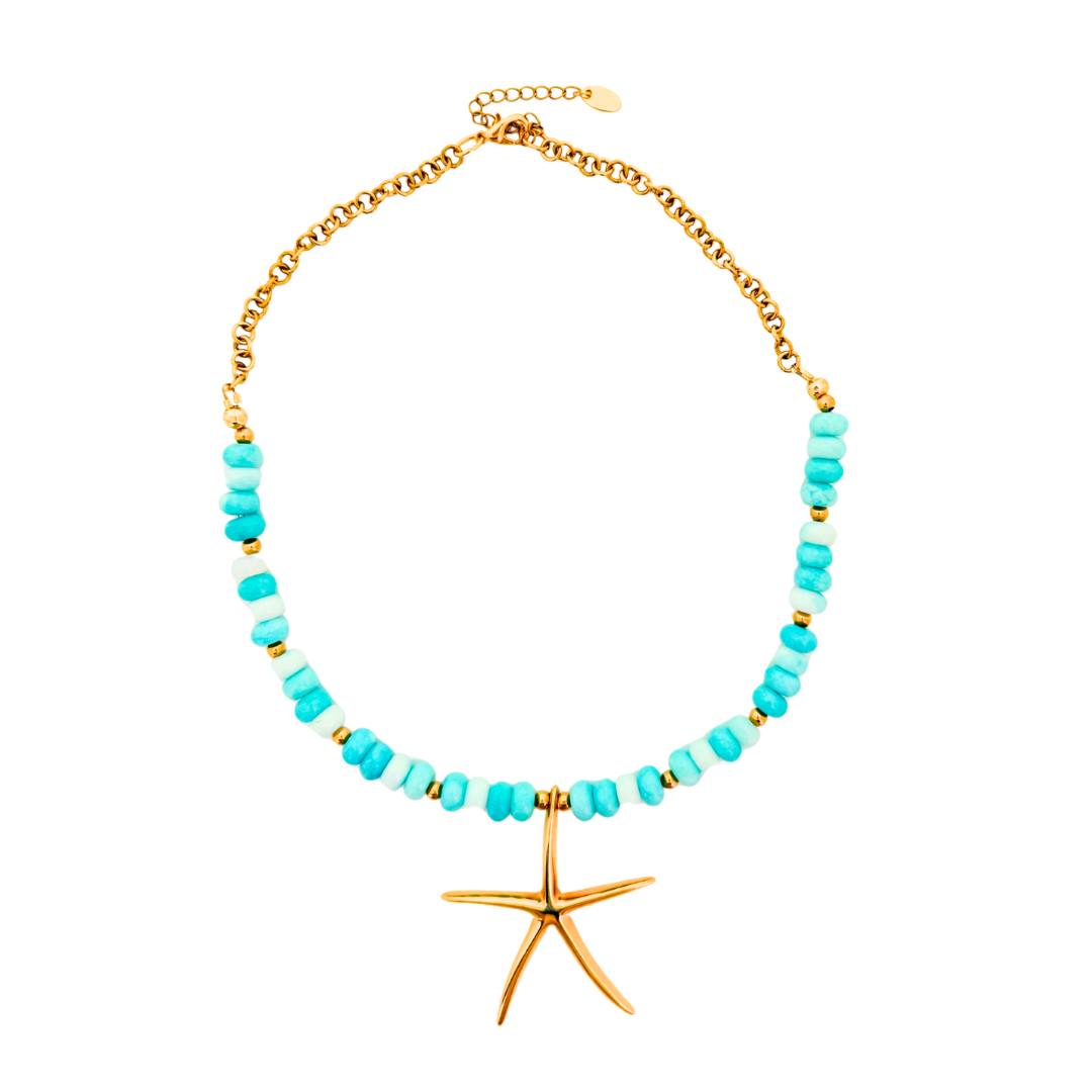 A gold chain necklace featuring turquoise and light blue beads, accented with small gold spacer beads, and a gold starfish pendant at the center, shown on a plain white background.