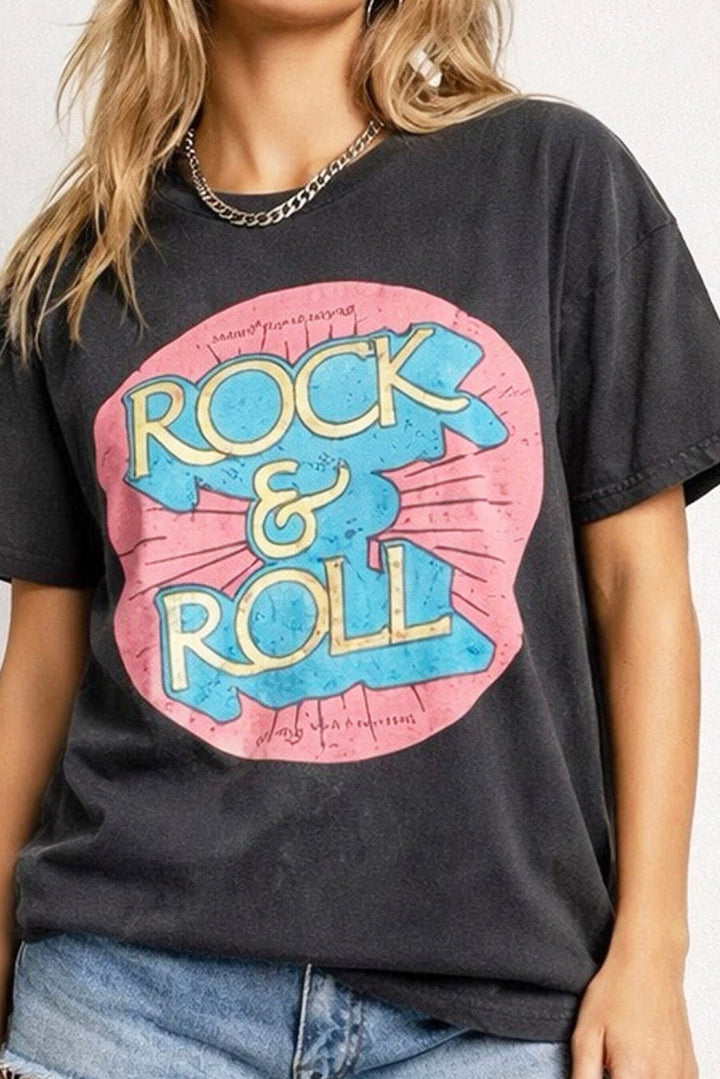 Woman wearing a black t-shirt with 'Rock & Roll' graphic design on a plain background