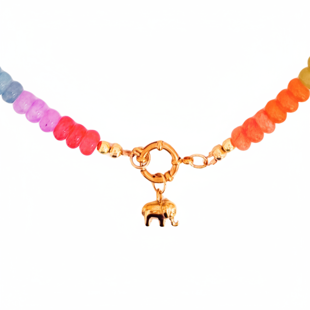 A beaded necklace with a rainbow gradient of pastel and bright beads, featuring a gold-toned clasp with a small elephant charm, shown against a plain white background.