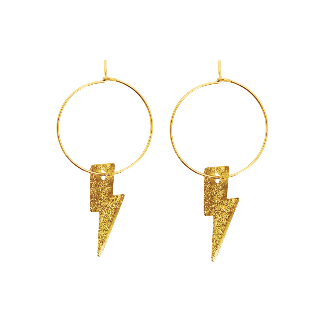 Gold hoop earrings with lightning bolt charms on a white background