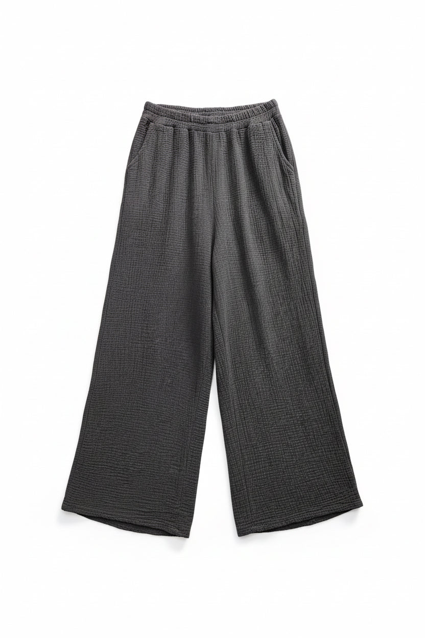 Dark gray ribbed knit pants on a white background