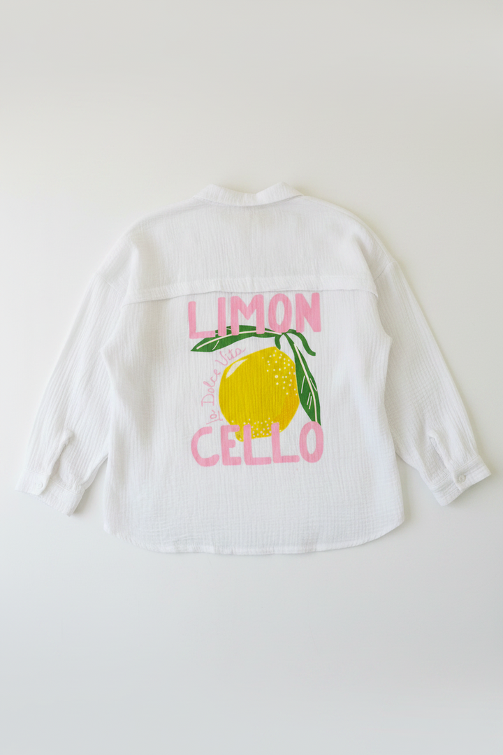 White shirt with lemon graphic and text 'Limon Cello' on a plain background