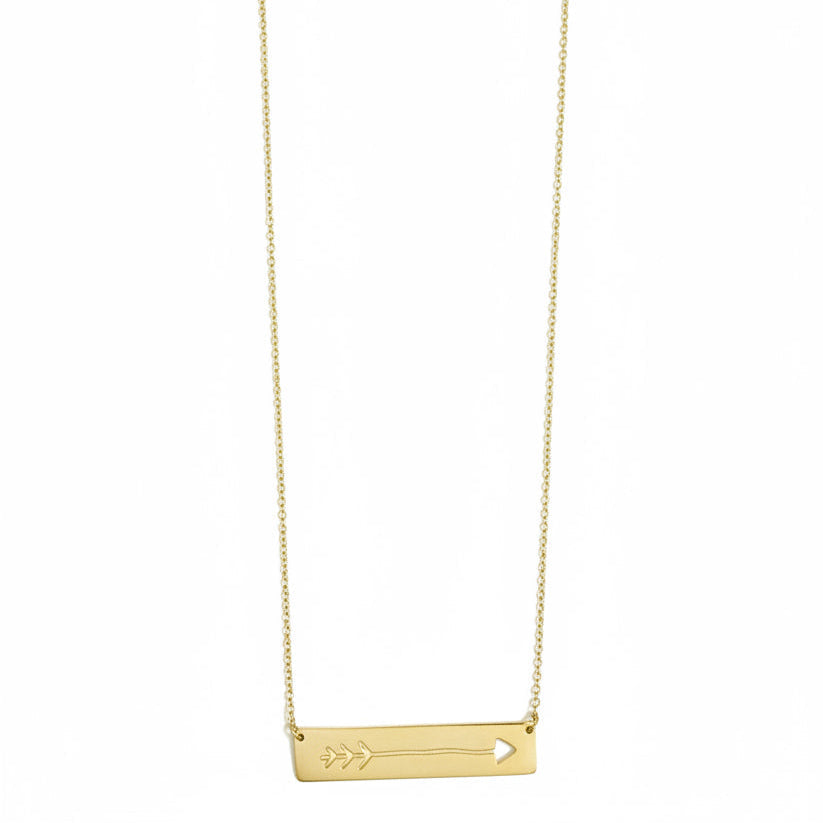 Gold necklace with a small pendant on a white background