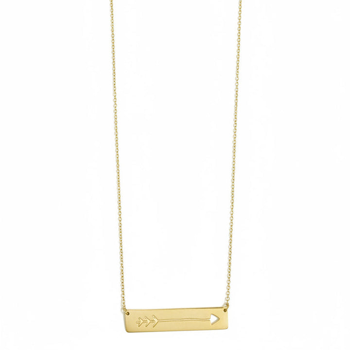 Gold necklace with a small pendant on a white background