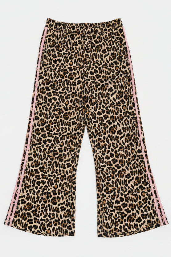 Leopard print pants hanging on a white door