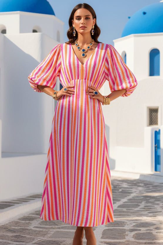 Colorful striped dress on a mannequin against a white background