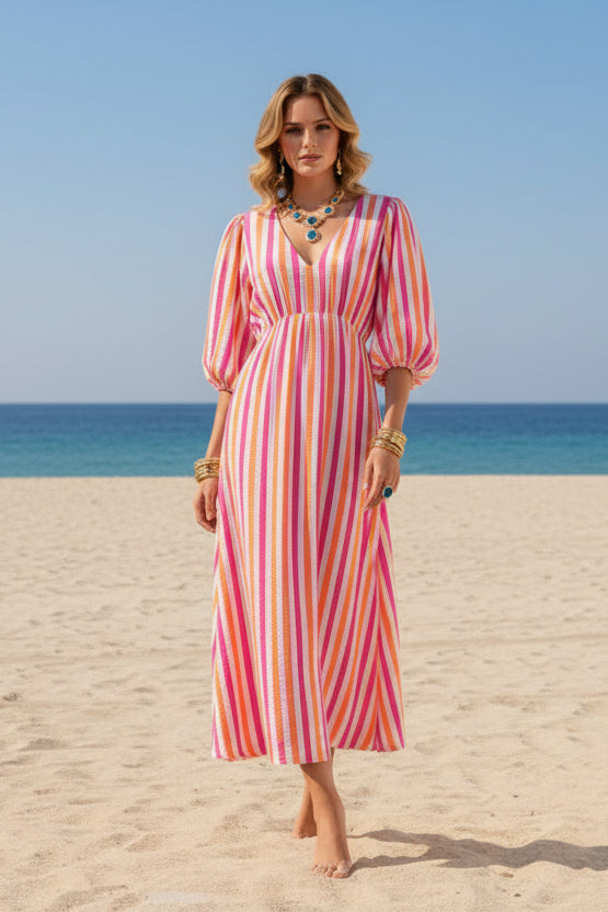 Colorful striped dress on a mannequin against a white background