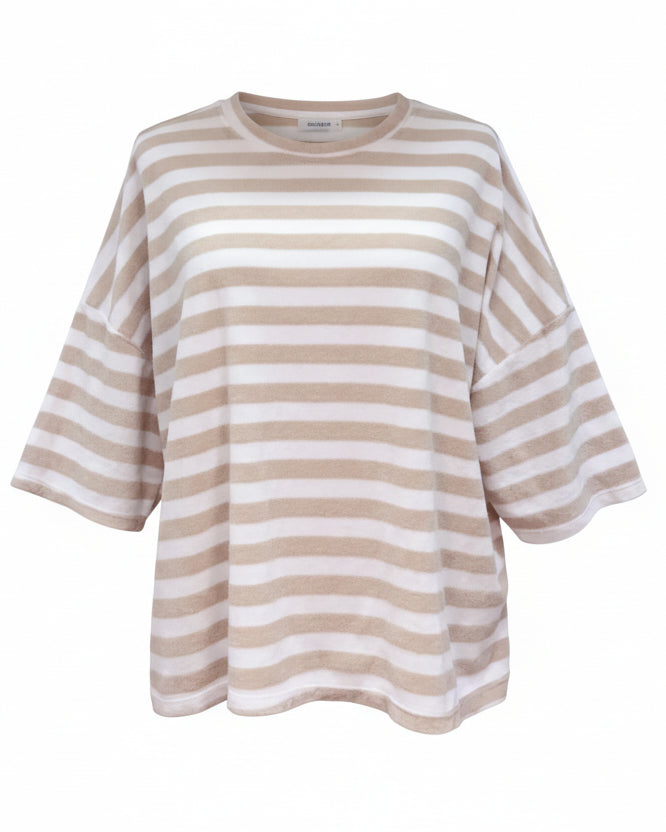 Beige and white striped shirt on a mannequin against a plain background