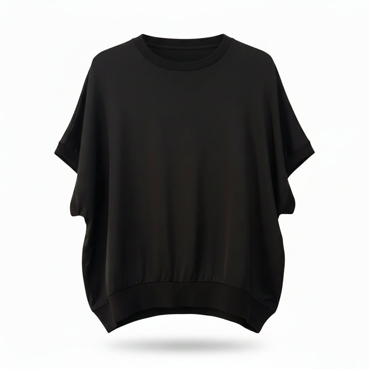 Black top on a wooden hanger against a white background
