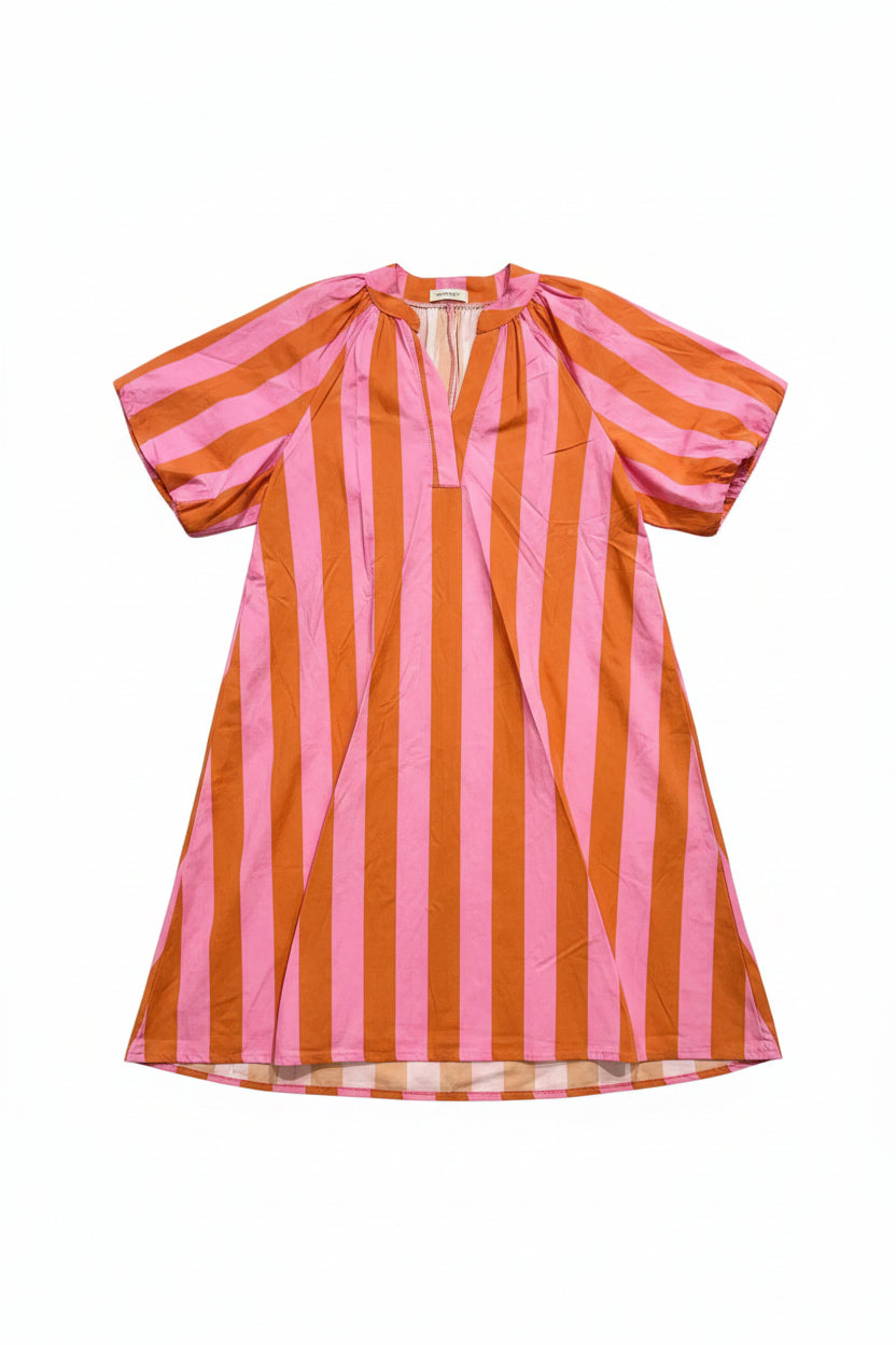 A loose, short-sleeved kaftan-style dress with vertical pink and orange stripes, hanging on a white hanger against a plain white background.