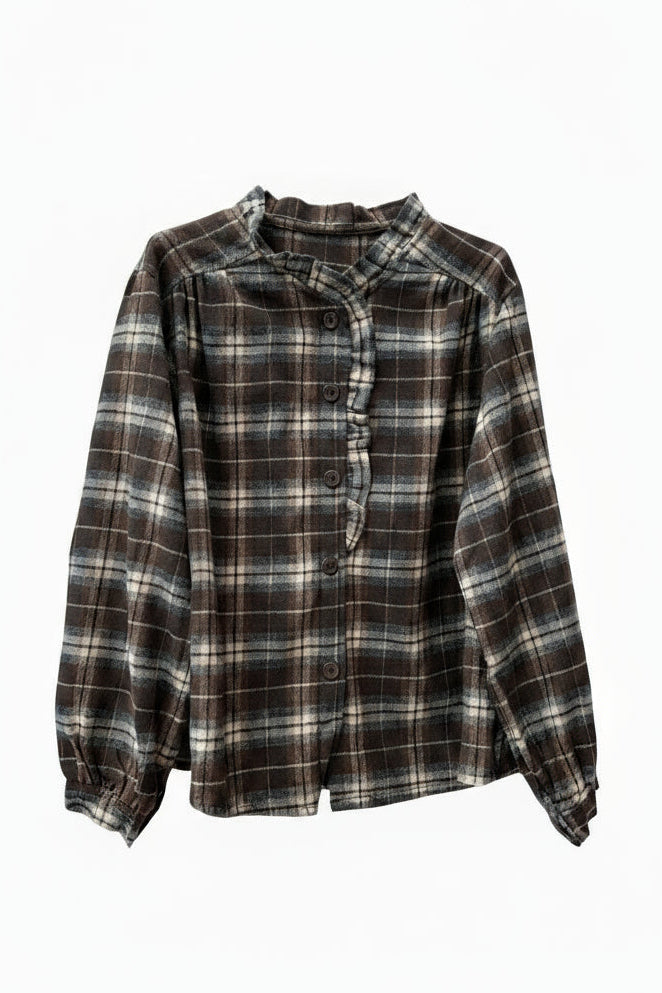 Plaid shirt on a white wooden surface