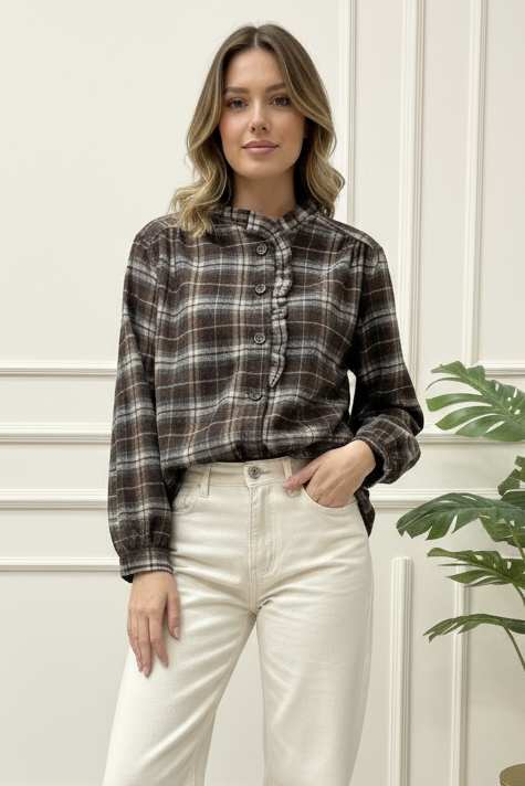 Plaid shirt on a white wooden surface