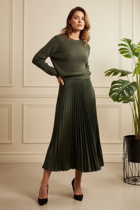 Green dress on a white rack with clothes in the background