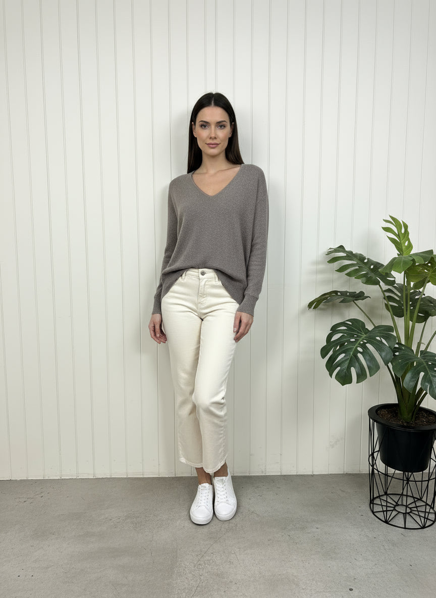 Gray fleece pullover on a white radiator