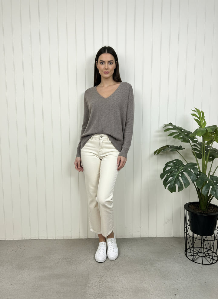 Gray fleece pullover on a white radiator