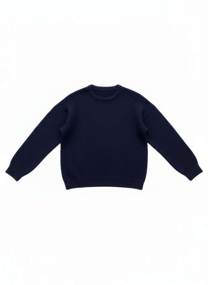 Navy blue sleeveless top on a white wooden surface