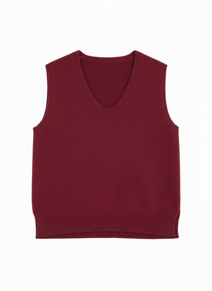 Maroon sweater on a hanger with jeans in the background