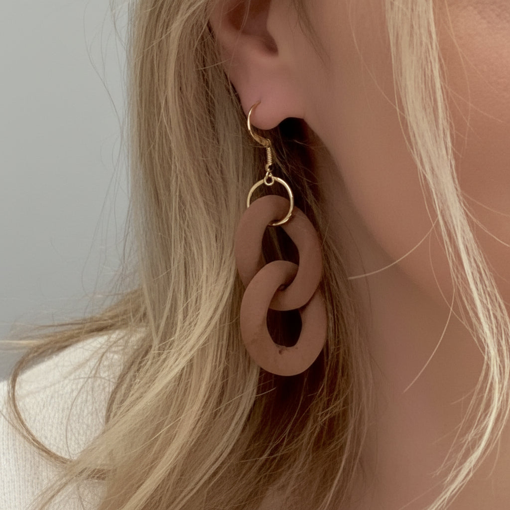 Woman in a white sweater with text in a clothing store