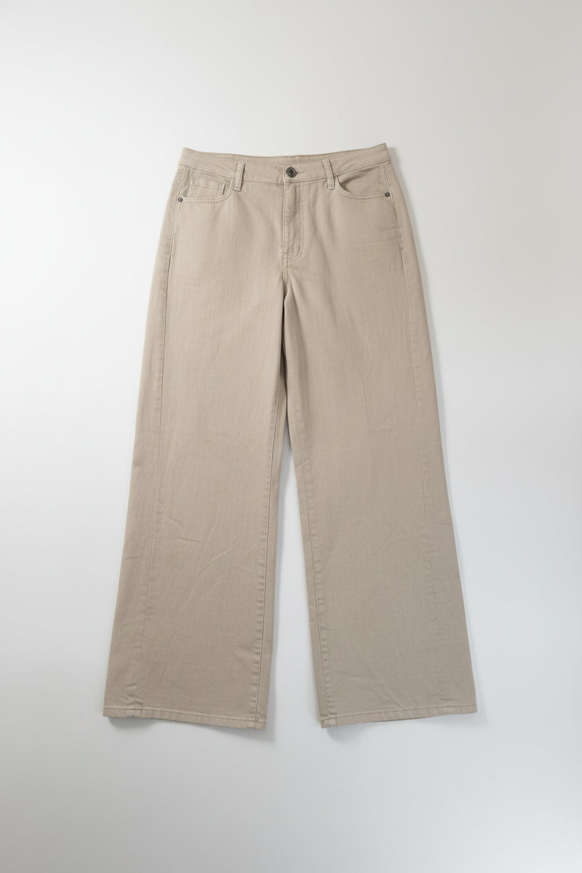 Beige pants on a hanger against a white background