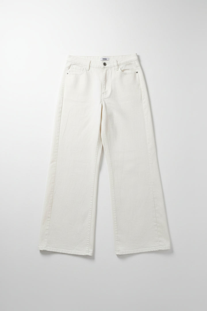 White pants on a hanger against a white background