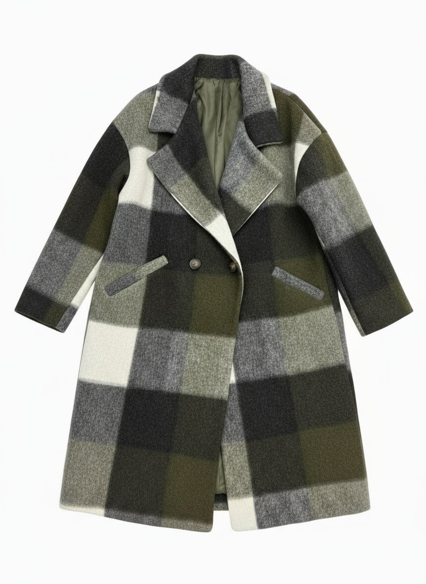 Folded plaid coat on a rack with a blurred background