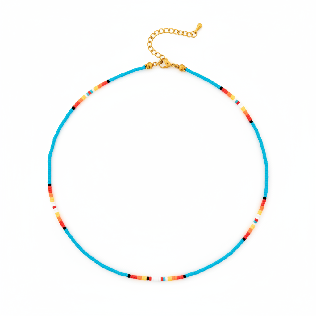 A beaded necklace with a bright turquoise blue main strand, accented by small segments of orange, yellow, red, and black beads, finished with a gold-tone clasp and extender chain, shown on a plain white background.