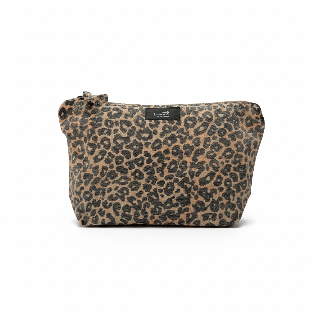 A leopard print cosmetic pouch with a top zipper and a small black brand label, shown against a plain white background.