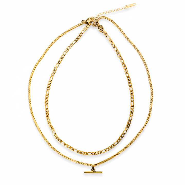 Two gold necklaces on a white background
