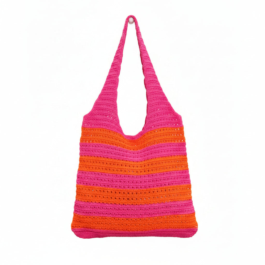 Crocheted bag with pink and orange stripes on a white background
