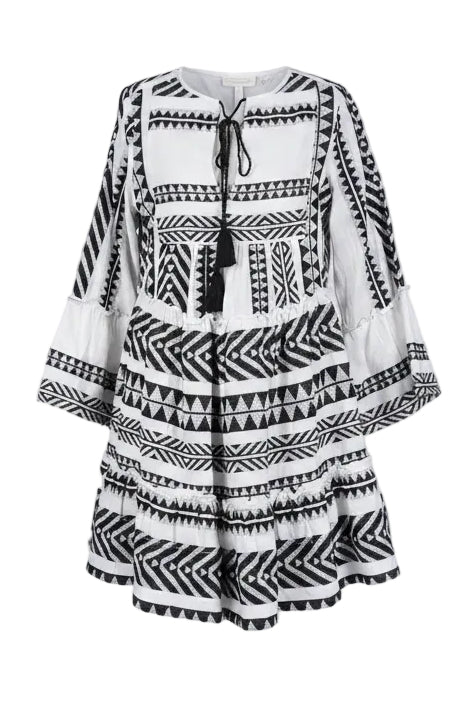 Black and white patterned dress on a mannequin against a gray background