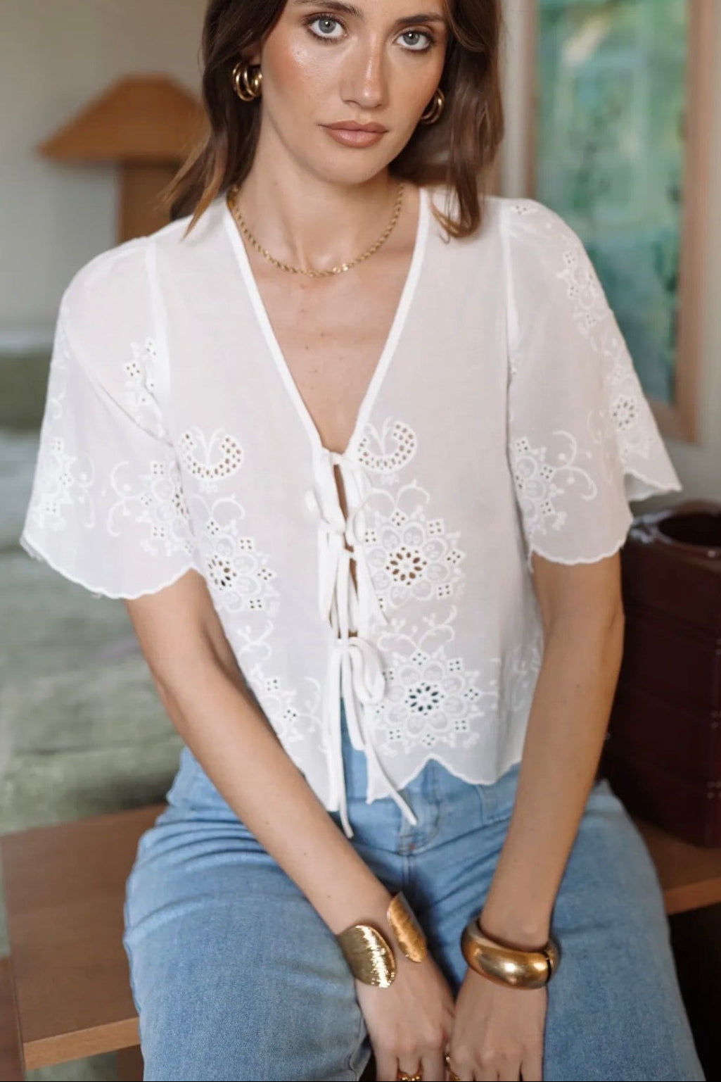 boho white blouse with ties and embroidery girl wearing it