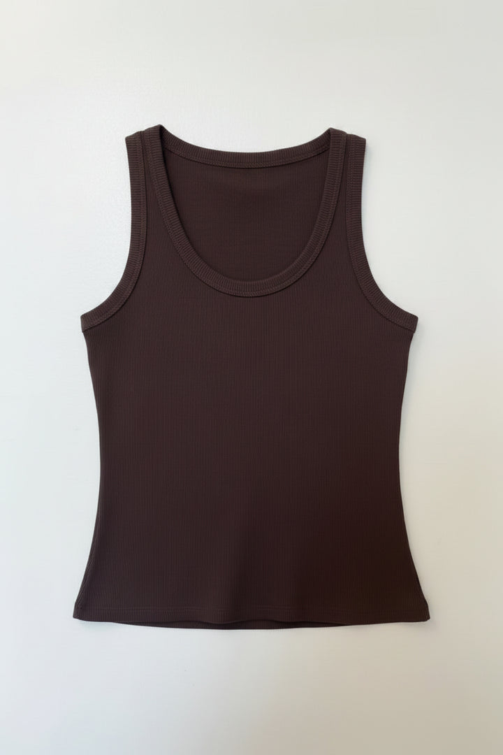 Brown tank top on a wooden hanger against a white background