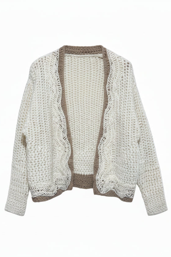 Knitted beige sweater on a mannequin with a label against a light gray background