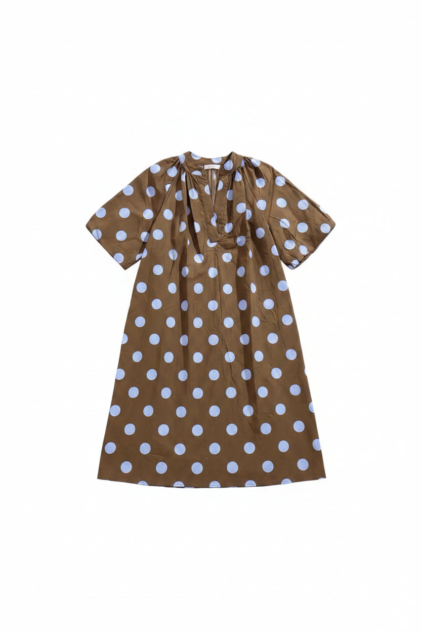 A brown short-sleeve dress with a white polka dot pattern, hanging on a wooden hanger against a white background.