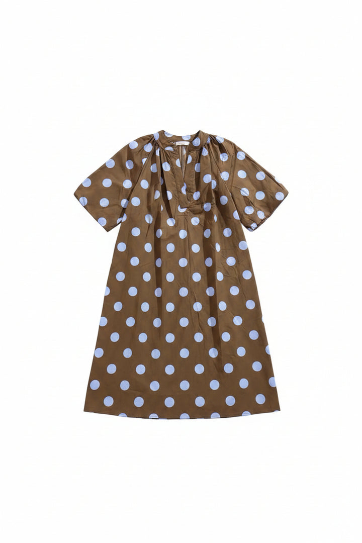 A brown short-sleeve dress with a white polka dot pattern, hanging on a wooden hanger against a white background.