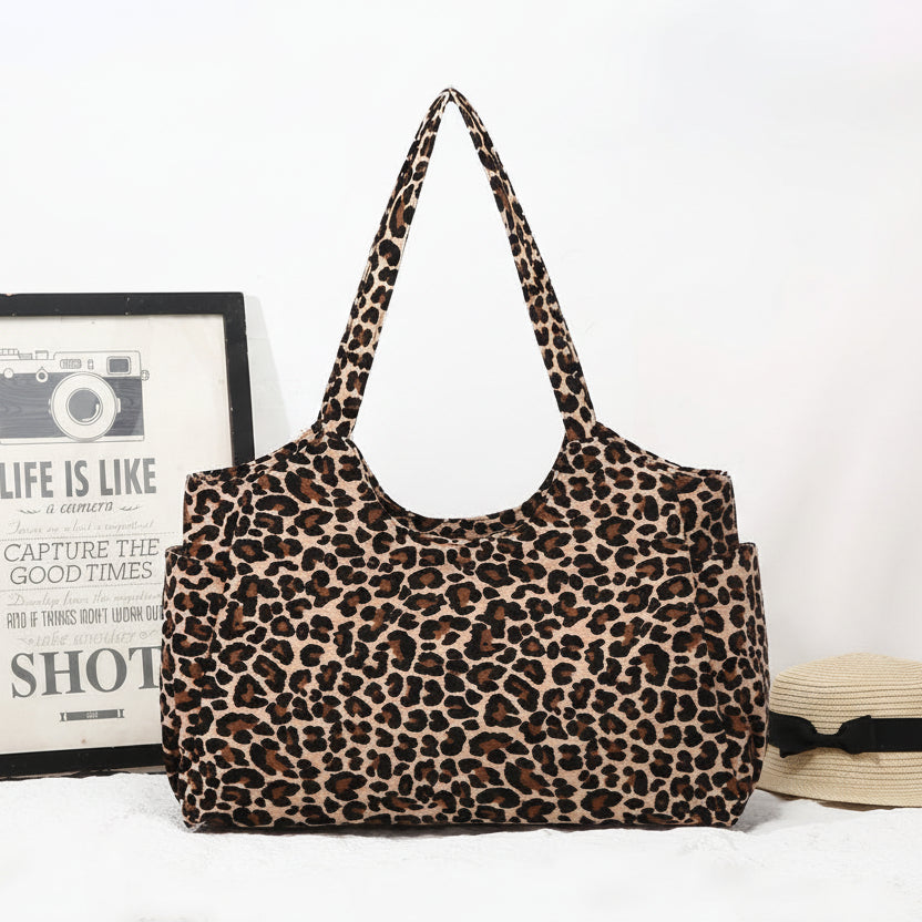 Leopard print handbag on a white background with 'L. Brown' branding.