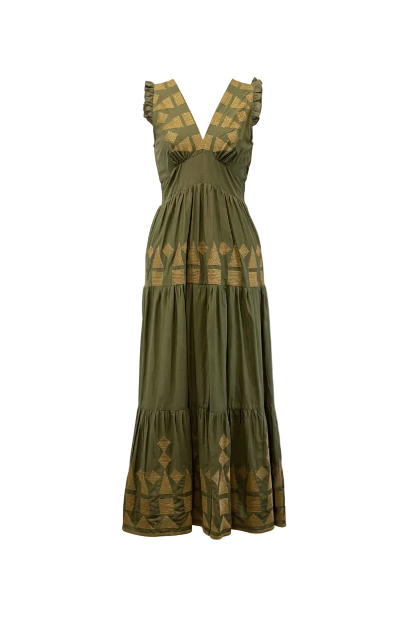 An olive green tiered maxi dress with gold geometric patterns, displayed on a black dress form mannequin against a white wall.