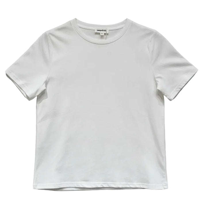 A plain white short-sleeve crewneck t-shirt hanging on a wooden hanger against a light gray textured wall.