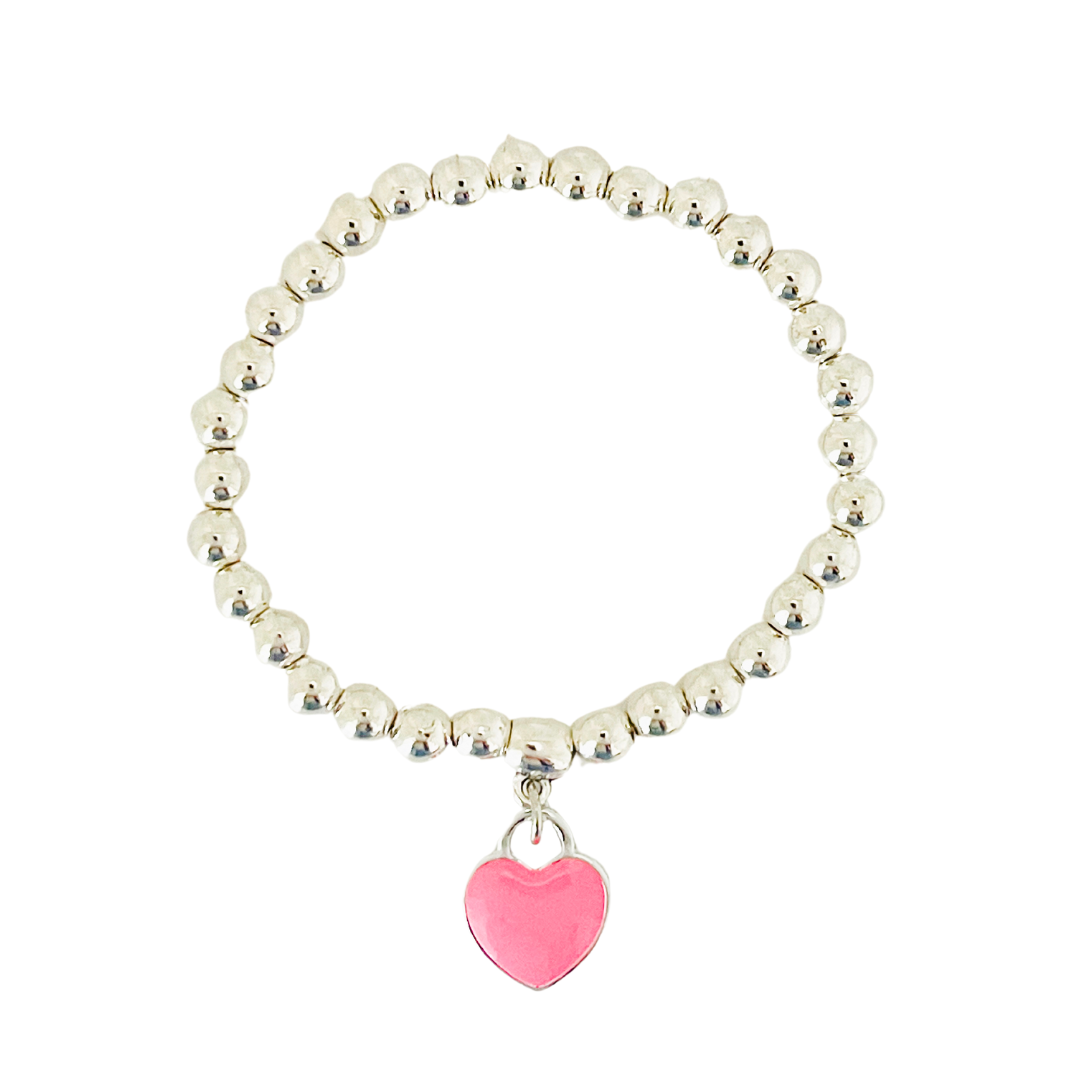 A pink heart charm bracelet with silver-colored beads and a pink heart pendant.