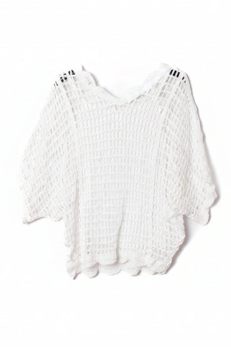 White open-knit cropped top with wide sleeves and a scalloped hem, hanging on a black hanger against a plain white background.
