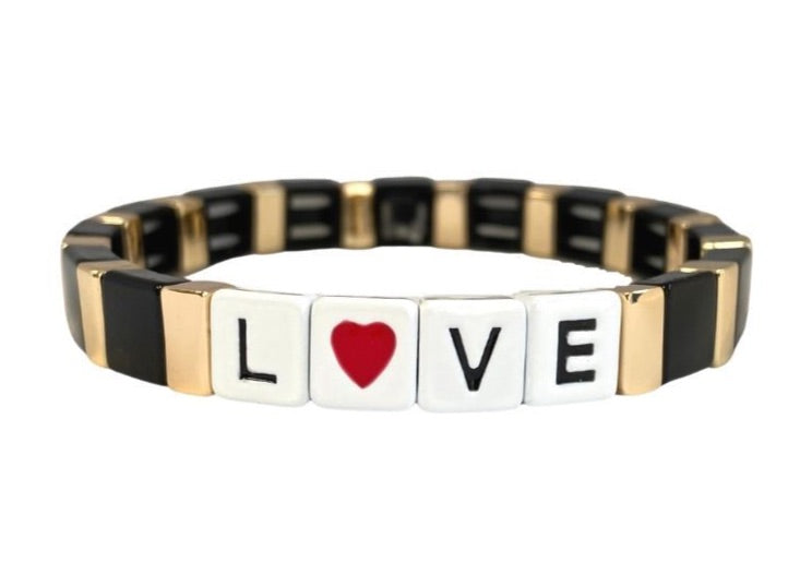 Accessory bracelet with black and gold enamel tiles and Love heart slogan