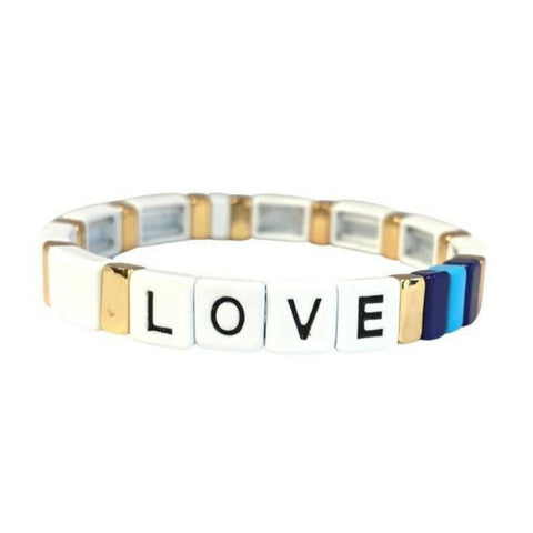 Boho accessory bracelet with white, gold and blue enamel tiles and Love slogan
